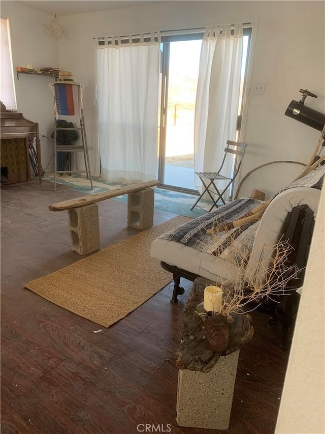 sitting room with dark hardwood / wood-style flooring