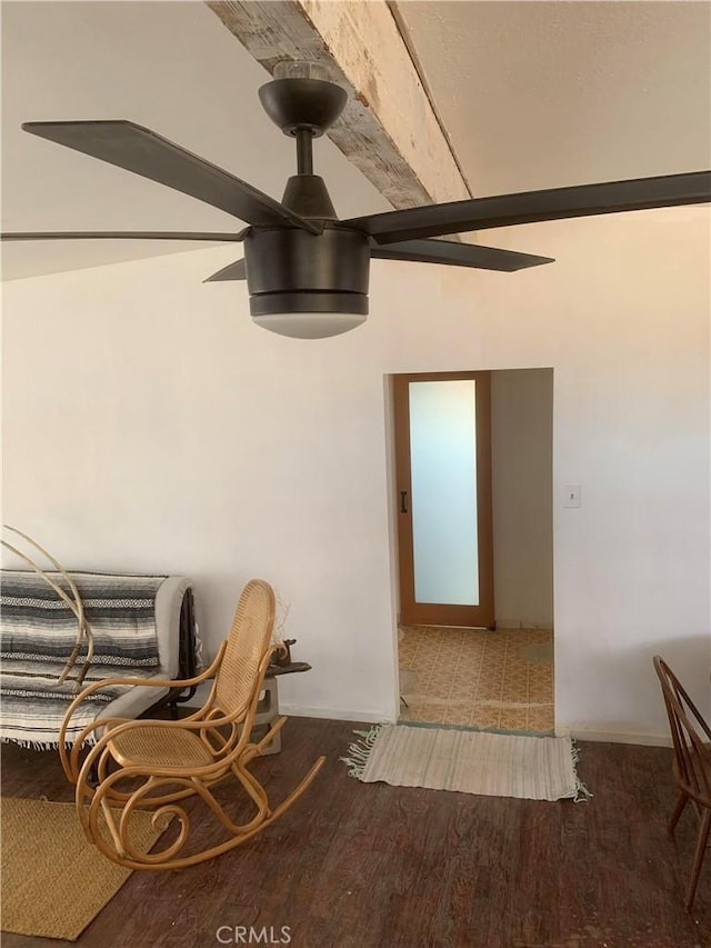 interior space with ceiling fan and dark hardwood / wood-style flooring