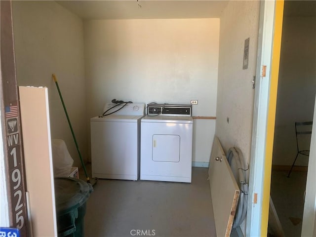 laundry room with washing machine and dryer