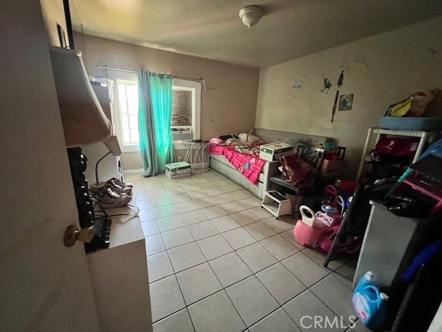 bedroom featuring light tile patterned floors