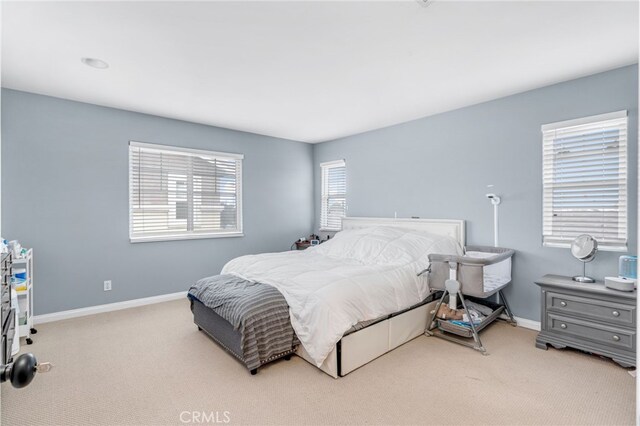 bedroom with carpet floors and baseboards