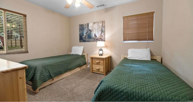 carpeted bedroom featuring ceiling fan