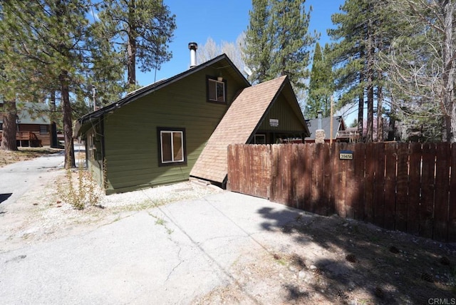 39414 Ruby Ln, Big Bear Lake, CA 92315 - view of side of property with fence and a patio