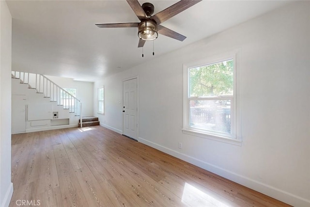 unfurnished living room with light hardwood / wood-style floors and ceiling fan