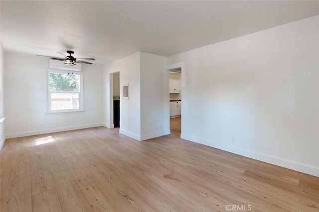 unfurnished living room featuring ceiling fan and light hardwood / wood-style floors