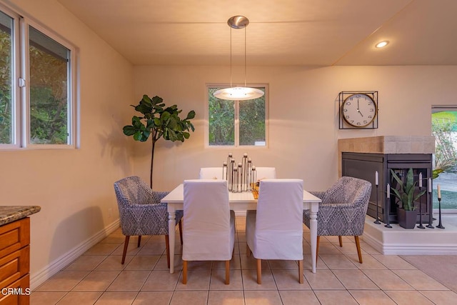 dining area with light tile patterned flooring