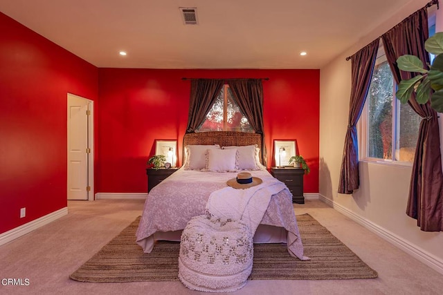 bedroom with light colored carpet