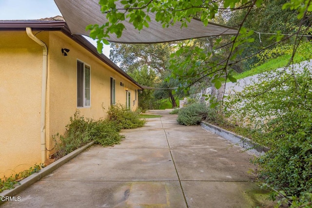 view of home's exterior with a patio area