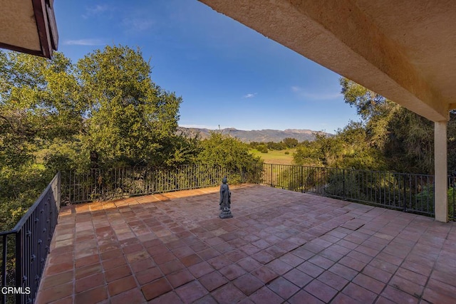 view of patio / terrace featuring a mountain view