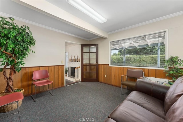 613 E Chapman Ave, Fullerton, CA 92831 - carpeted living area with wainscoting, wooden walls, and ornamental molding