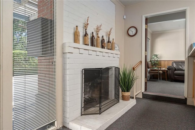 613 E Chapman Ave, Fullerton, CA 92831 - detailed view of carpet flooring, crown molding, wainscoting, a heating unit, and a fireplace