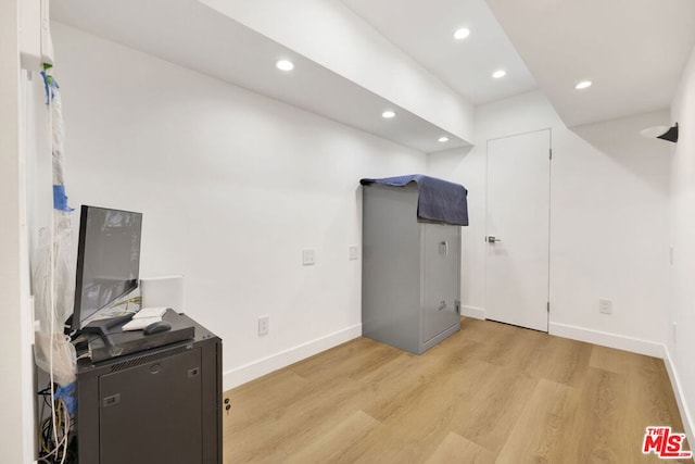 office space with light hardwood / wood-style flooring