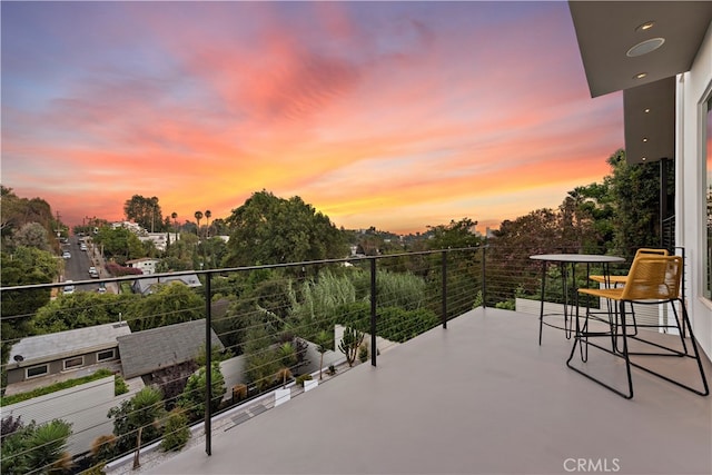 view of balcony at dusk