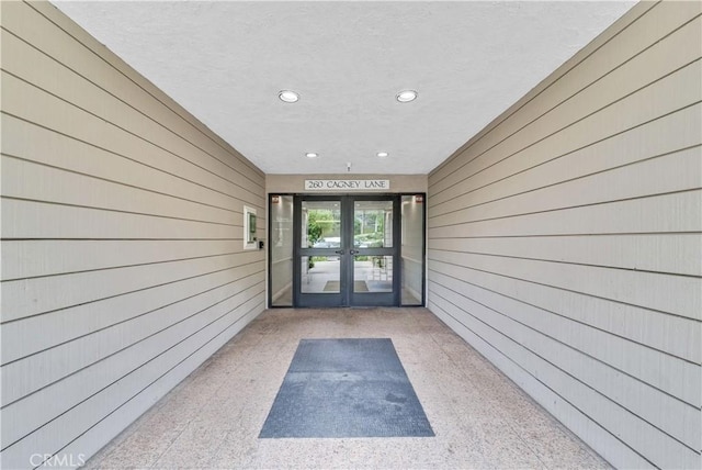 doorway to property featuring french doors