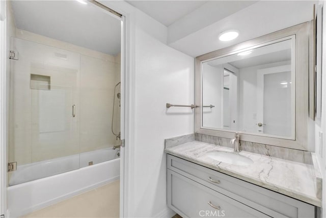 bathroom featuring vanity, tile patterned flooring, and shower / tub combination