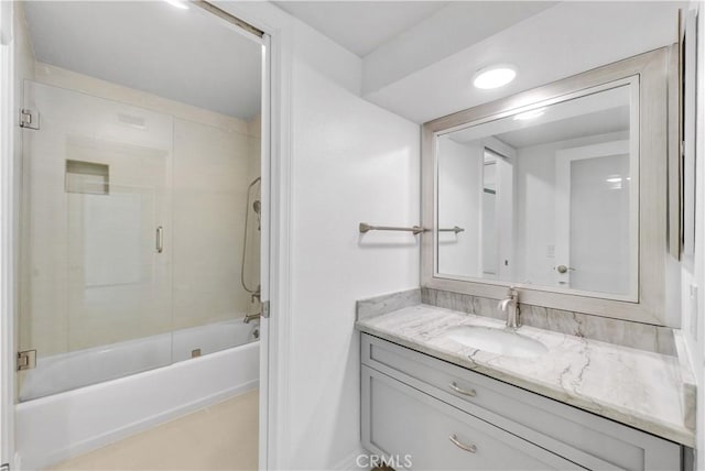 bathroom with bathtub / shower combination, tile patterned floors, and vanity