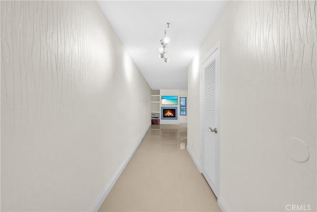 260 Cagney Ln Unit 105, Newport Beach, CA 92663 - corridor featuring baseboards and light tile patterned flooring