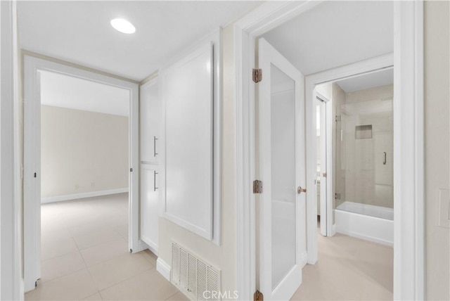 hallway featuring light tile patterned floors