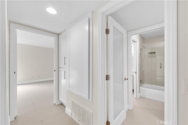 260 Cagney Ln Unit 105, Newport Beach, CA 92663 - corridor with light tile patterned floors and baseboards