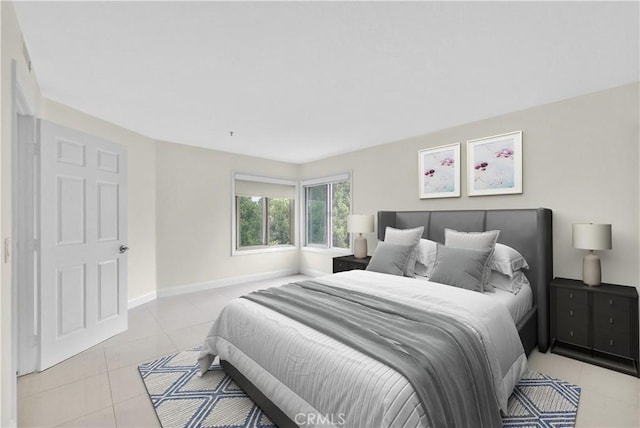 260 Cagney Ln Unit 105, Newport Beach, CA 92663 - bedroom featuring light tile patterned floors and baseboards