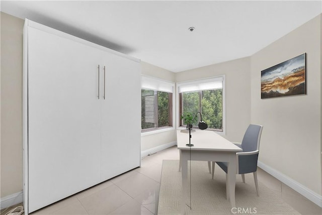 260 Cagney Ln Unit 105, Newport Beach, CA 92663 - home office featuring baseboards and light tile patterned flooring