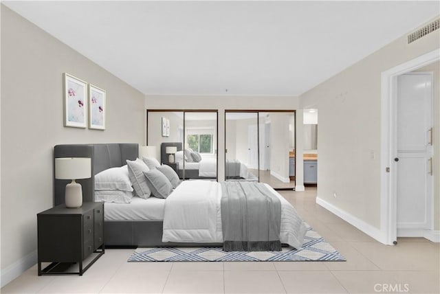 260 Cagney Ln Unit 105, Newport Beach, CA 92663 - bedroom featuring multiple closets and light tile patterned floors