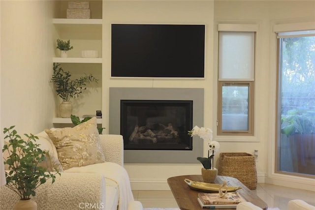 260 Cagney Ln Unit 105, Newport Beach, CA 92663 - living room featuring a glass covered fireplace and built in features
