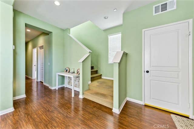 staircase featuring hardwood / wood-style flooring