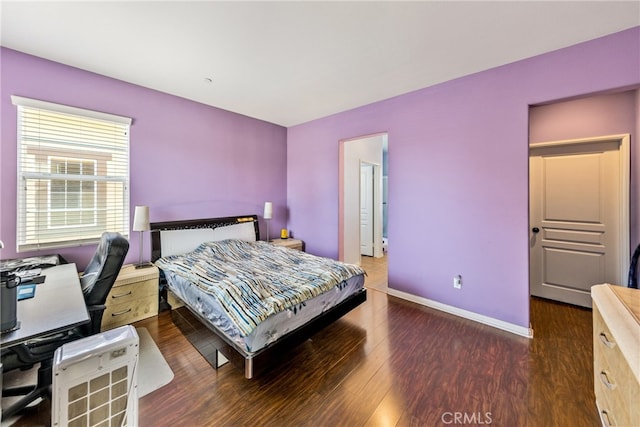 bedroom featuring dark hardwood / wood-style flooring