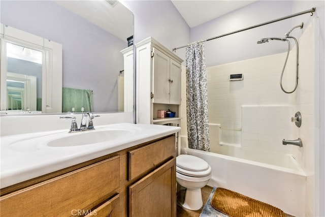 full bathroom featuring shower / bath combination with curtain, vanity, and toilet