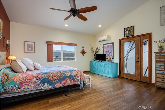 bedroom with access to exterior, lofted ceiling, hardwood / wood-style floors, a wall mounted air conditioner, and ceiling fan