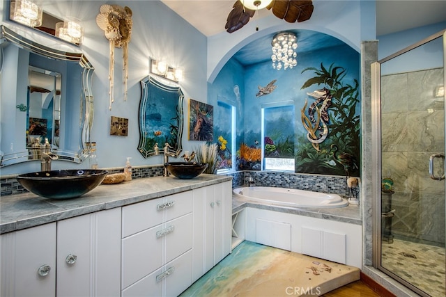 bathroom featuring shower with separate bathtub, vanity, hardwood / wood-style floors, and ceiling fan