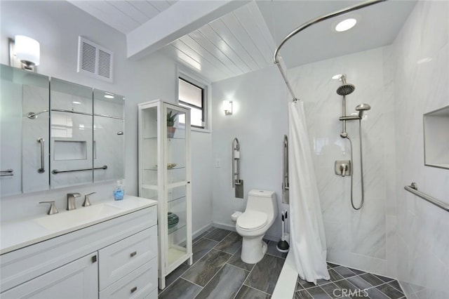 bathroom with a shower with shower curtain, vanity, and toilet