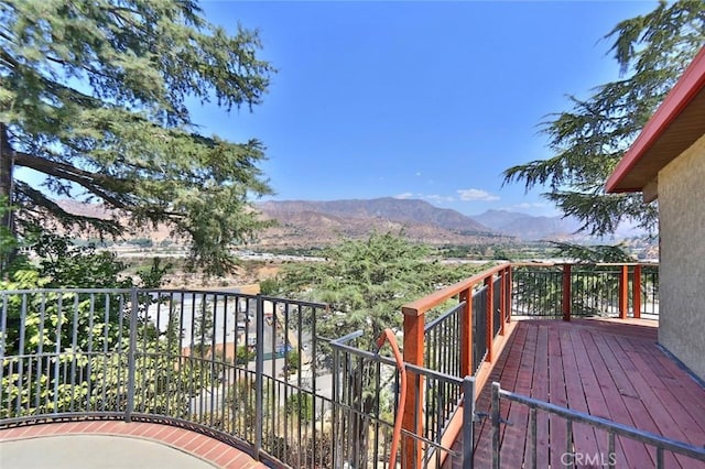 wooden terrace with a mountain view