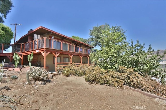 view of front of home with a deck