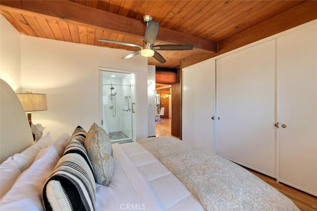 bedroom with beam ceiling, connected bathroom, ceiling fan, hardwood / wood-style floors, and wood ceiling