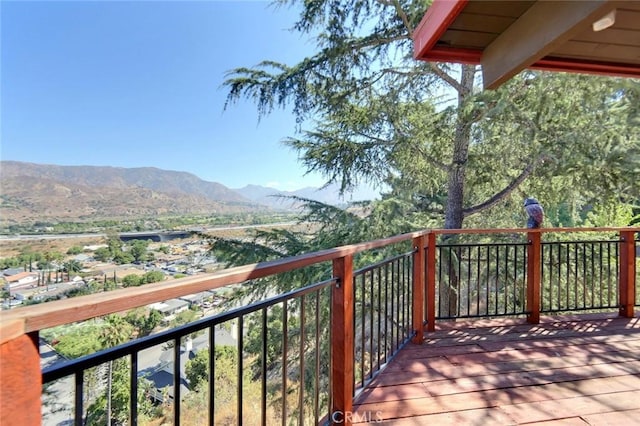 wooden terrace featuring a mountain view