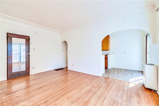 spare room featuring light hardwood / wood-style flooring