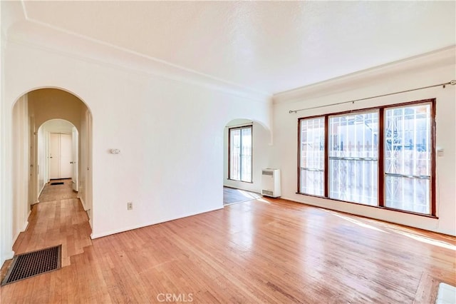 empty room with light hardwood / wood-style floors