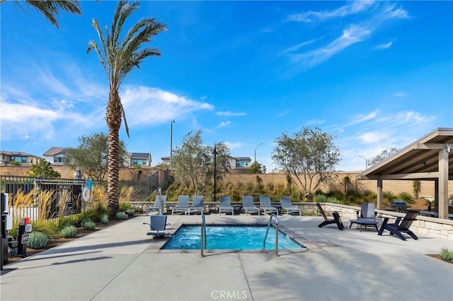 view of pool featuring a patio