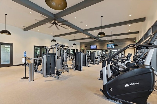 gym featuring light carpet and ceiling fan