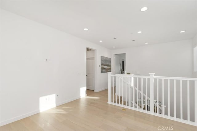 unfurnished room with light wood-type flooring