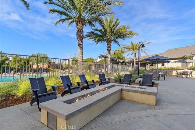 view of patio / terrace featuring a fire pit