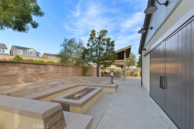 view of patio featuring an outdoor fire pit