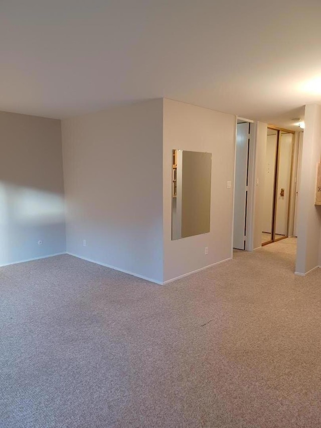 empty room with carpet flooring