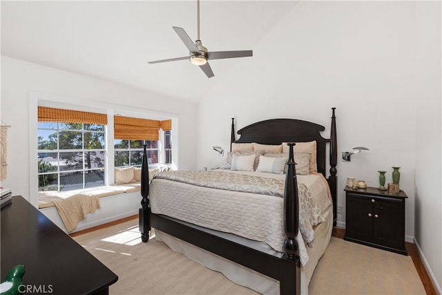 bedroom featuring vaulted ceiling, ceiling fan, and light hardwood / wood-style flooring