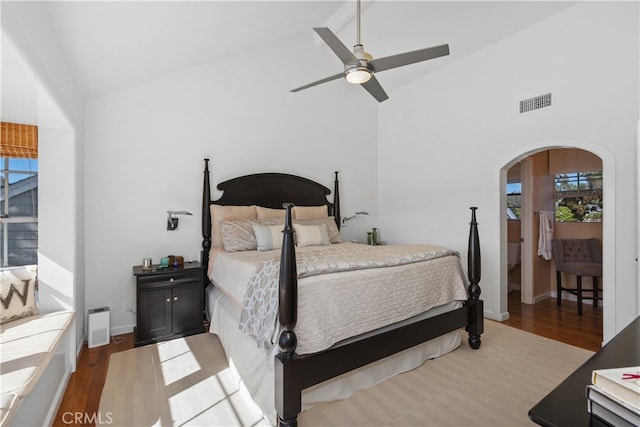 bedroom featuring high vaulted ceiling, light wood-type flooring, and ceiling fan