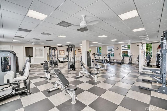 gym featuring a paneled ceiling and ceiling fan