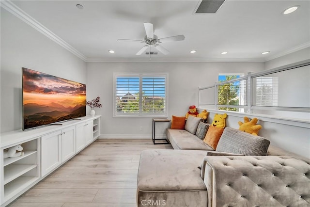 living room with light wood-type flooring, ceiling fan, and crown molding