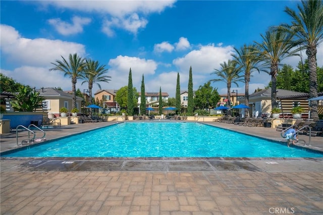 view of swimming pool featuring a patio area